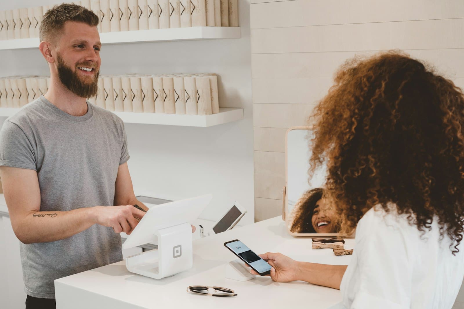 Customer checking out at a retail counter